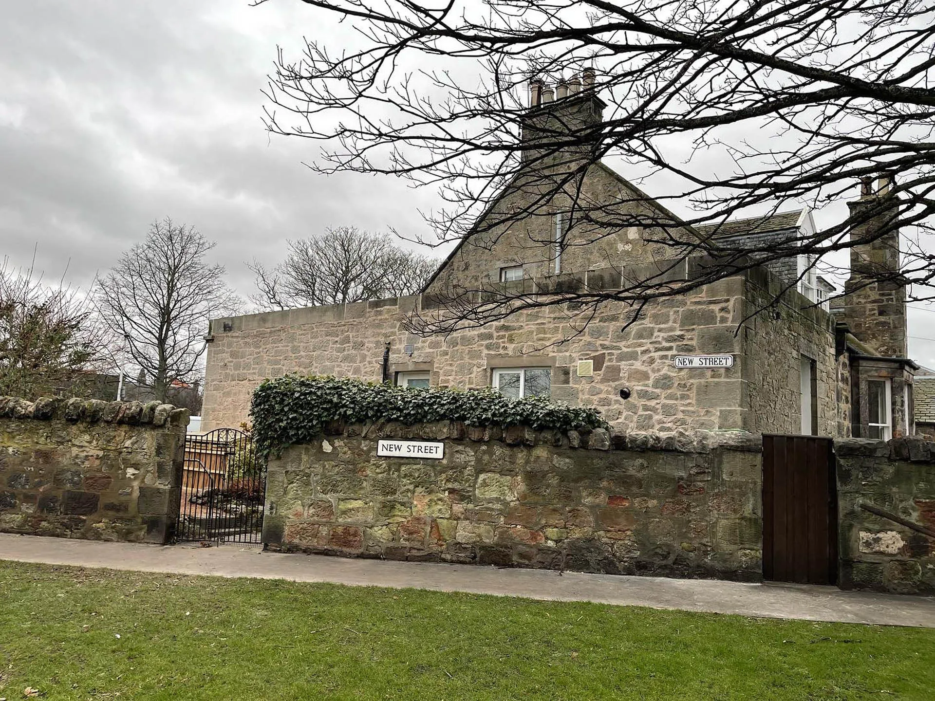 Stone lodge building with a slate roof after repointing