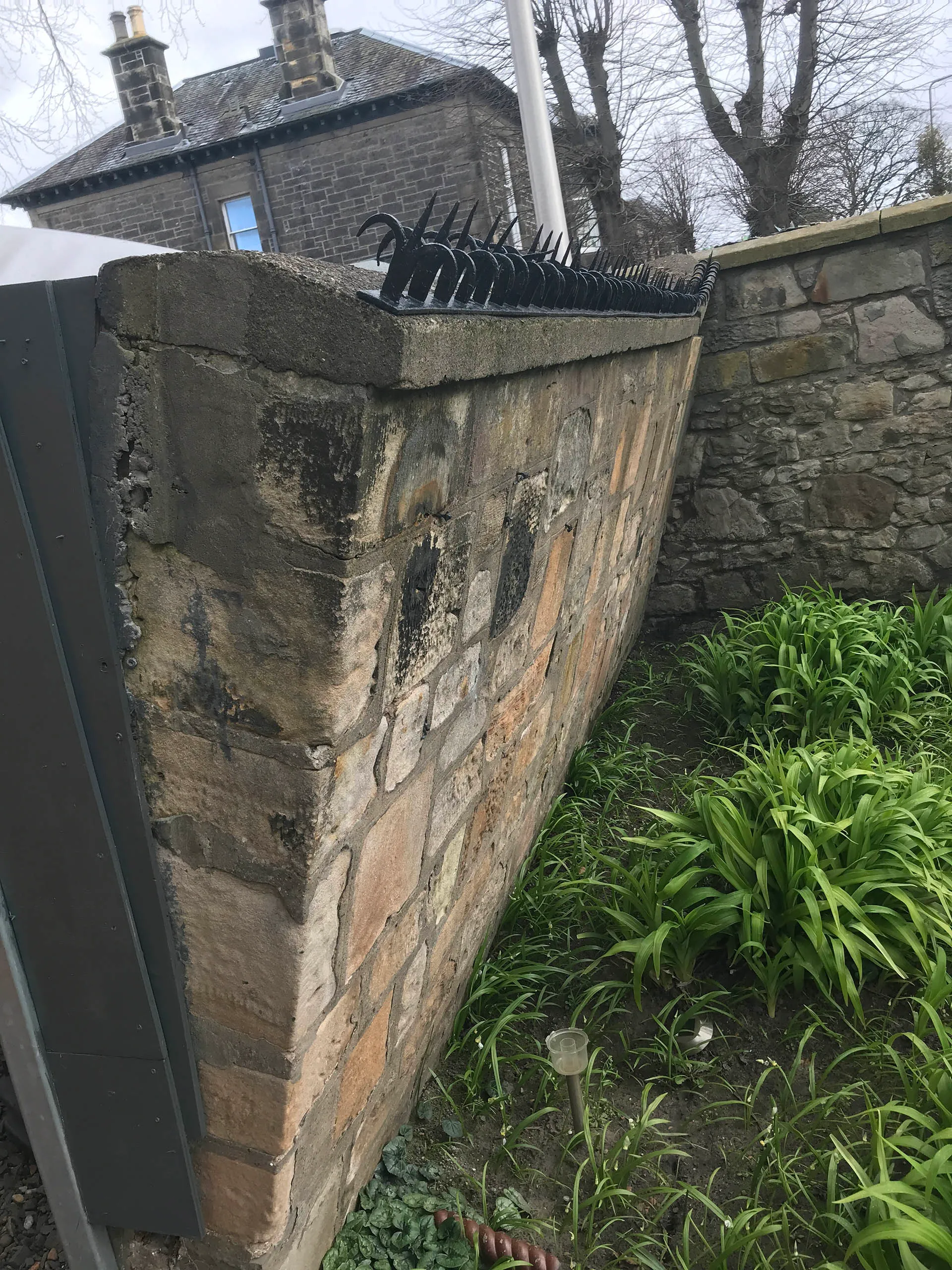 Rubble stone wall newly repointed in lime mortar